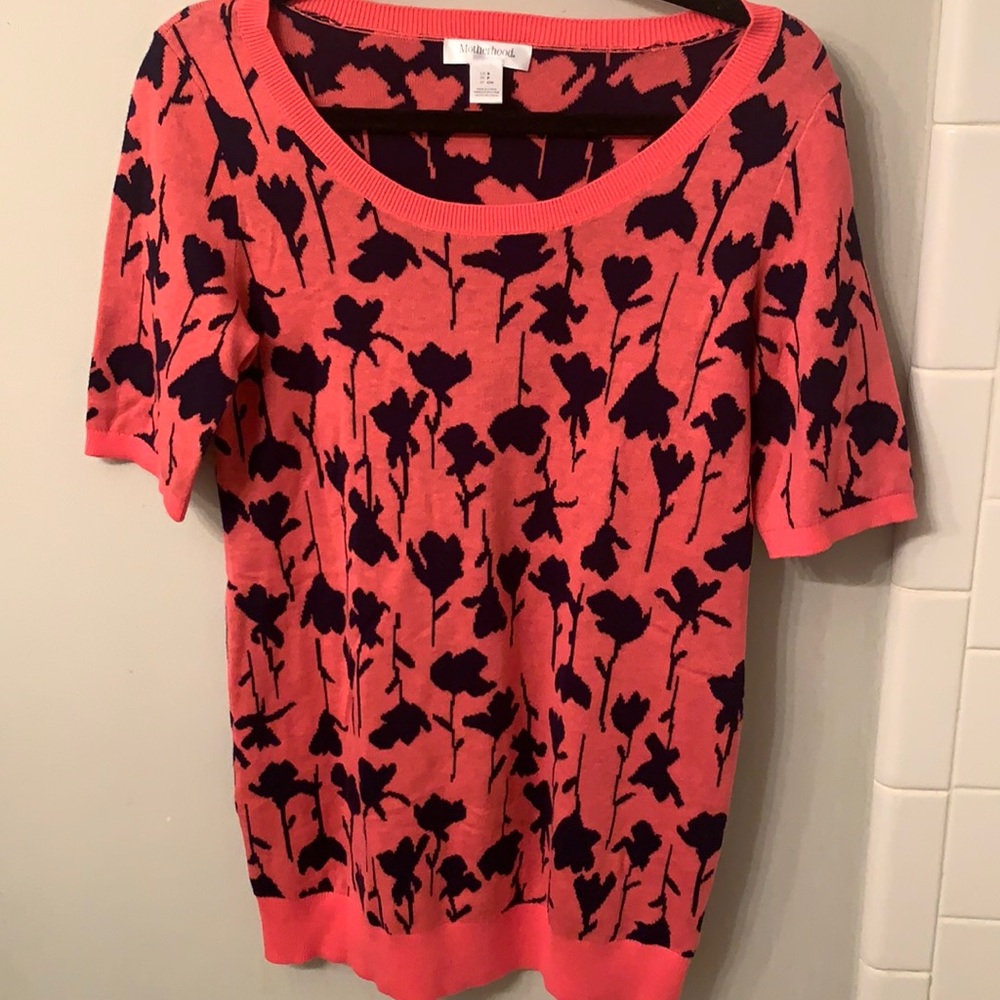 Motherhood cute sweater with pink and black flower pattern